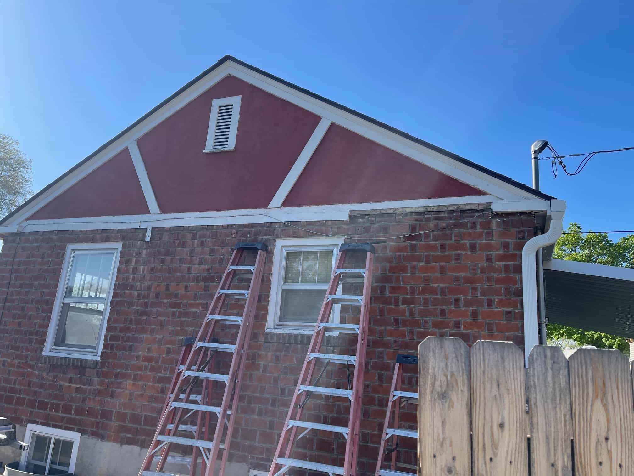 Damaged siding before repair